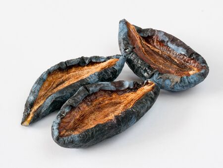 Dried plum - prunes fruits on a white backgroundの写真素材