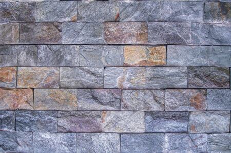 Natural stone background. Old stone wall background texture close up.の写真素材