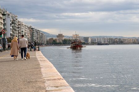 THESSALONIKI, GREECE - People walking on the coast in Thessaloniki next to the White tower