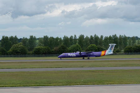 LONDON, STANSTED AIRPORT, UK - JULY 16, 2019: Stansted airport, Flybe aircraft getting ready to...