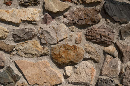 Background texture of stone wall. Natural stone, a wall of natural stoneの写真素材