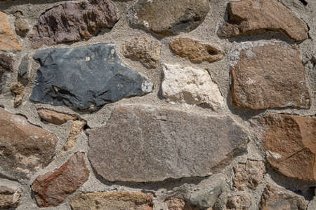 Background texture of stone wall. Natural stone, a wall of natural stoneの写真素材