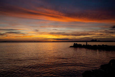 Inspirational calm sea with sunset sky. Meditation ocean and sky background. Sandy beach at sunrise....