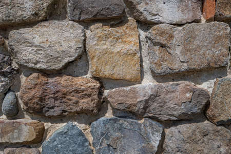 Background texture of stone wall. Natural stone, a wall of natural stoneの写真素材