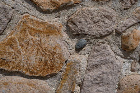Background texture of stone wall. Natural stone, a wall of natural stoneの写真素材