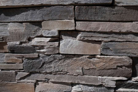 Background texture of stone wall. Natural stone, a wall of natural stoneの写真素材