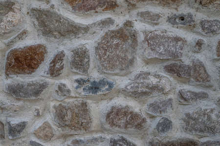 Background texture of stone wall. Natural stone, a wall of natural stoneの写真素材