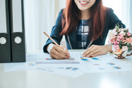 Female employee preparing analysisの写真素材