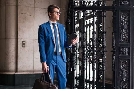 portrait of a pensive businessman in the streets