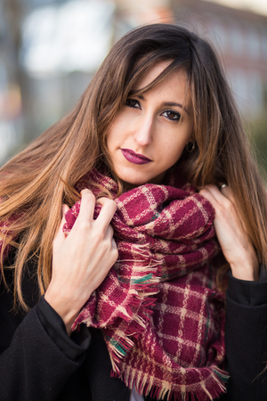 portrait of an attractive stylish young woman in the streetの写真素材