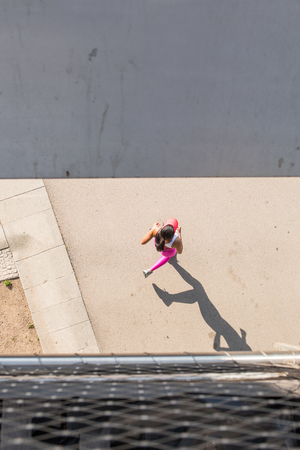 top view of a fit woman athlete running outdoorsの写真素材