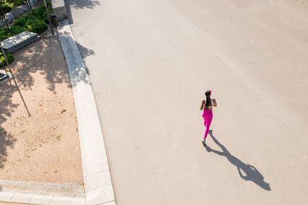 top view of a fit woman athlete running outdoorsの写真素材