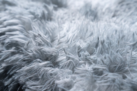 Close up white shaggy artificial fur texture or carpet for background.の写真素材