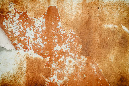 Brown, black and yellow rust and dirt on white enamel. Rusted brown and white abstract texture....