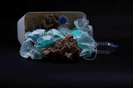 face mask in trash sanitary napkins, plastic. Medical waste unhygienic management concept. Disposal...