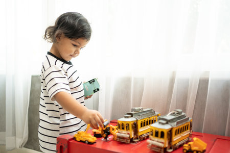 Little boy playing with colorful plastic blocks at kindergarten or at home. Development toys for preschooler childrenの写真素材