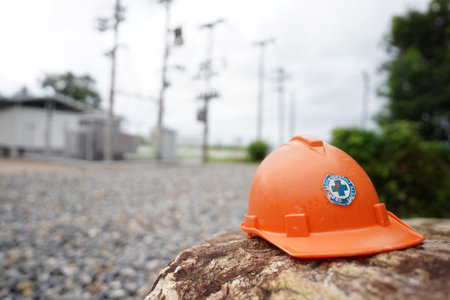 Orange safety helmet on a rock in the construction site, stock photoの写真素材