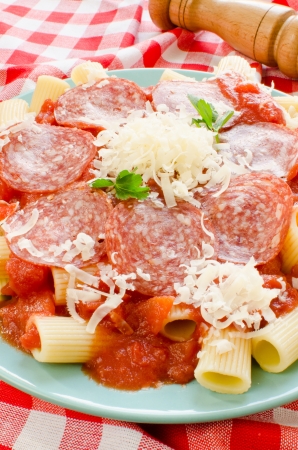 Rigatoni pasta with tomato sauce and pepperoniの写真素材
