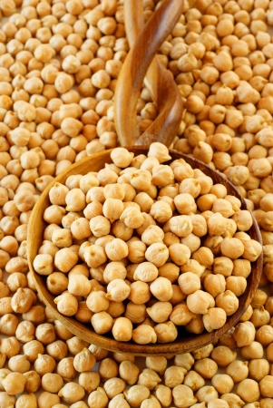 Chickpeas on African wooden spoonの写真素材