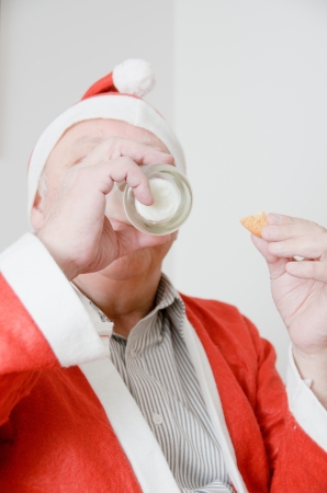 Santa Claus drinking milkの写真素材