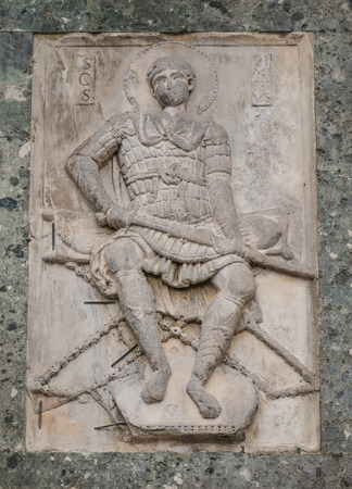 Bas-relief of St. George, a warrior saint, at the facade of St. Mark's Basilicaの写真素材