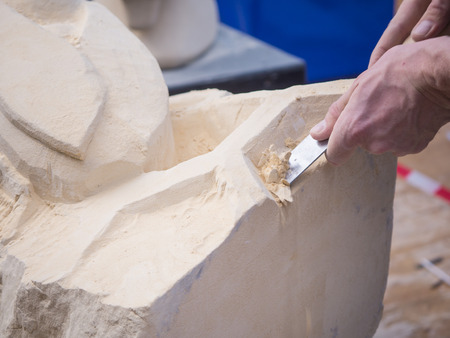 ALMERE, NETHERLANDS - OCT. 26: Marl stone carving artist at work during the annual Sculpture Festival being held in the townsquare of Almere on June 26, 2013のeditorial素材