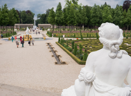 APELDOORN, NETHERLANDS - JUNE 14: View on palace Het Loo with visitors in the gardens on June 14, 2013. The palace, which houses a museum,  was built in the 17th century and is one of the palaces still owned by the Dutch royal family.のeditorial素材