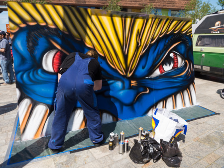 ALMERE, NETHERLANDS - JUNE 30: Artist performing cartoonesque street art during the annual Steet Art Festival held in the streets of the city of Almere on June 30, 2013のeditorial素材