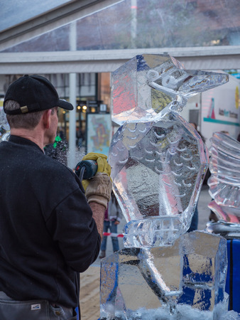 ALMERE, NETHERLANDS - OCT. 26: Ice sculptor at work during the annual Sculpture Festival being held in the townsquare of Almere on June 26, 2013のeditorial素材