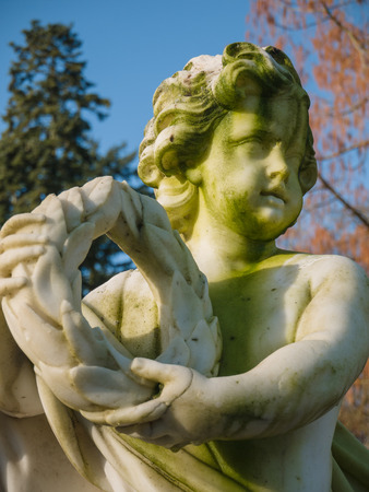 Cherub in the garden of Soestdijk Palace in the Netherlands holding a wreathのeditorial素材