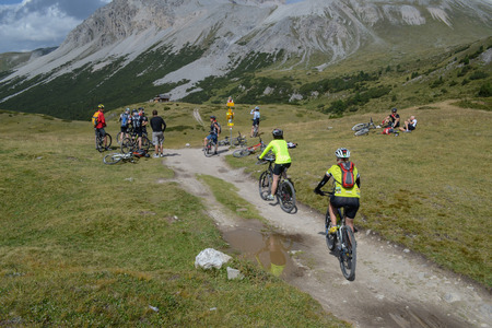 GRAUBUNDEN, SWITZERLAND - 20 AUGUST 2012:  Unidentified mountain bikers taking part in the yearly held multi-day recreational mountain bike tour called 'Mountain Rally' in Switzerland in the summer 2012のeditorial素材