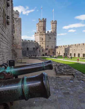 CAERNARFON, WALES - 29 SEPTEMBER 2013: Caernarfon Castle, well-known for its polygonal towers, dates from the 13th century.  In 1969 Prince Charles was invested here as Prince of Wales by HM Queen Elizabeth II.のeditorial素材