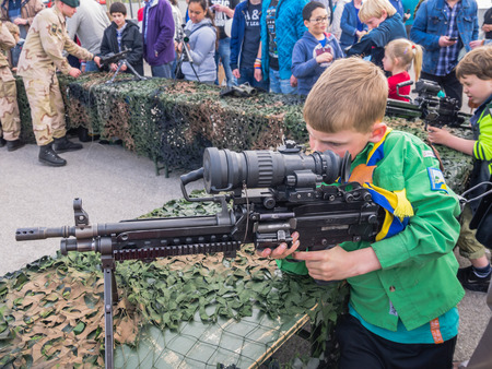 ALMERE, NETHERLANDS - 12 APRIL 2014: Assault rifle as used by the Dutch military on display for kids to touch and hold during the first National Security Day held in the city of Almereのeditorial素材