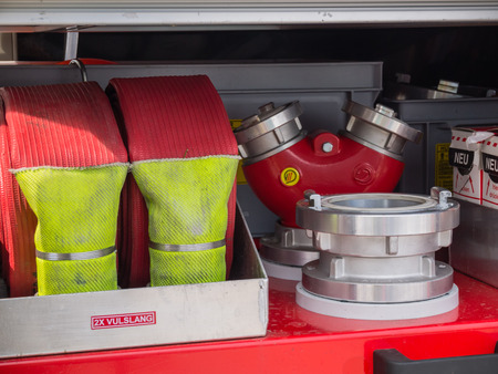 ALMERE, NETHERLANDS - 12 APRIL 2014: Valves and hoses of a modern Dutch fire engine on display...