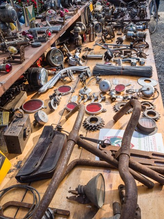 GAIOLE IN CHIANTI, ITALY - 4 OCT. 2014: Vintage bike parts on display in a market stall at L\'Eroica, a touristic and historic cycling event for owners of vintage bicycles who ride a tour through the province of Tuscany, mainly on gravel roads.のeditorial素材
