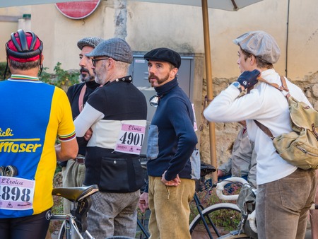 GAIOLE IN CHIANTI, ITALY - 5 OCT. 2014: Unidentified participants of L\'Eroica, a touristic and...