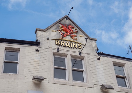 CARDIFF, WALES - 5 OCT. 2013: Exterior of Brains brewery showing the company's logo.  Brains brewery was founded in 1882 by Samuel Brains and is one of the larger breweries in South Wales.のeditorial素材