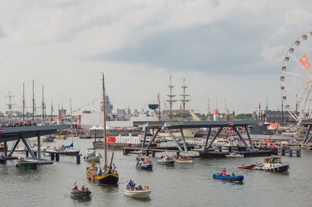 AMSTERDAM - 21 AUGUST 2015: A flotilla of ships gathered in Amsterdam harbour during Sail 2015. Sail is the world's biggest free nautical eventのeditorial素材