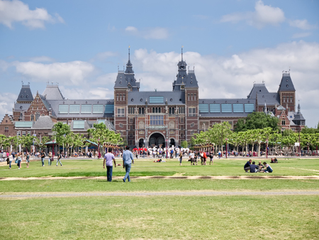 AMSTERDAM - 2 JULY 2014: Tourists in front of national Rijksmuseum, a popular destination for tourists. It attracts more than 2 million visitors each year from all over the worldのeditorial素材