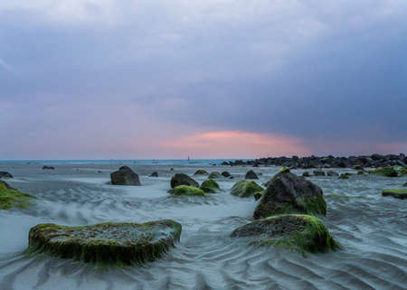 Mudflat along the Dutch coast at sunsetの写真素材