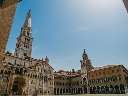 Metropolitan Cathedral with its Ghirlandina tower and the town hall in Modena, Italyのeditorial素材