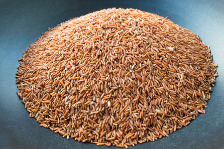 A lot of brown rice isolated on background.High benefit of body.Natural carbohydrate form rice plant...