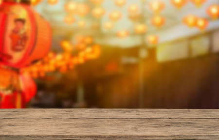 Wooden table top on blur china town festival background.For montage product display or design key visual layout.View of copy space.の写真素材