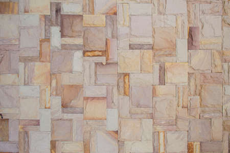 Bricks or sandstone slab make become wall background.Old or ancient surface.Neatly arranged.View of copy space.の写真素材