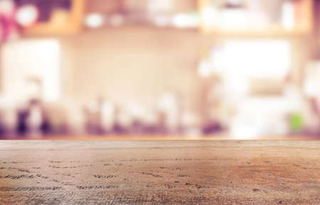 Wood table shelf on blur cooking kitchen background.For montage product display or design key visual...