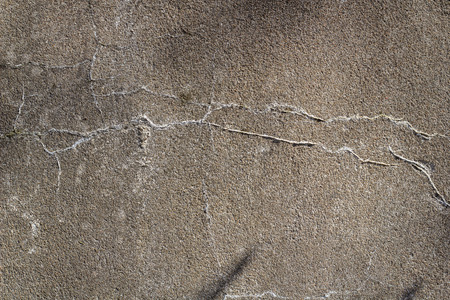 Grey concrete wall with scratchesの写真素材