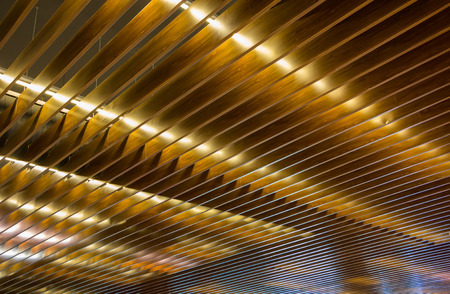 Background of yellow lighted woodの写真素材