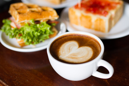 Coffee and bread with jamの写真素材