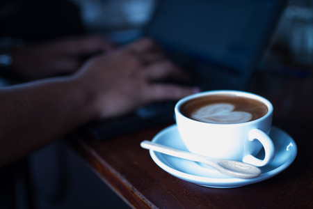 Hard Working with Mocca coffee in cafe Shopの写真素材