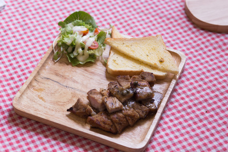 Pork steak with black pepper in cafe.の写真素材